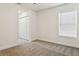 Comfortable bedroom with plush carpet, closet and a window at 2130 W Spruce St, Tampa, FL 33607