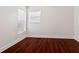 Bright bedroom featuring gleaming hardwood floors and neutral walls at 2130 W Spruce St, Tampa, FL 33607