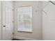 A walk-in closet with shelving and a window for natural light at 2130 W Spruce St, Tampa, FL 33607