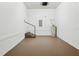 Clean garage interior with painted floor, door to house, and an efficient water heater at 2130 W Spruce St, Tampa, FL 33607