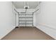 Clean garage interior with painted floor, garage door, and an overhead garage door opener at 2130 W Spruce St, Tampa, FL 33607