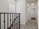 Bright hallway with neutral carpet, white walls, closet, and access to other rooms at 2130 W Spruce St, Tampa, FL 33607