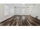 Well-lit living room featuring modern flooring, white walls, and ample space for furnishings at 2130 W Spruce St, Tampa, FL 33607