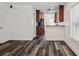 Open-concept living room showcases hardwood floors and a seamless flow into the updated kitchen at 2130 W Spruce St, Tampa, FL 33607