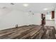 Open-concept living space with stylish flooring and seamless flow into the kitchen area at 2130 W Spruce St, Tampa, FL 33607