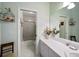 Clean, bright bathroom featuring a walk-in shower with glass door and neutral decor at 2175 Oak Forest Ln, Palm Harbor, FL 34683
