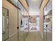 Well-lit bathroom featuring dual sinks, vanity, and separate tub and shower at 2175 Oak Forest Ln, Palm Harbor, FL 34683