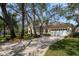 Lovely two-story home featuring a well-manicured lawn, lovely landscaping and a two-car garage at 2175 Oak Forest Ln, Palm Harbor, FL 34683