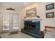 A fireplace with a white mantel and a green tiled hearth at 2175 Oak Forest Ln, Palm Harbor, FL 34683