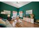 Cozy living room with wood floors, ample seating, and decorative accents providing a welcoming atmosphere at 2175 Oak Forest Ln, Palm Harbor, FL 34683