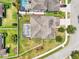 Aerial view of the property and surrounding area, showcasing a pool, landscaping and fencing at 21834 Southern Charm Dr, Land O Lakes, FL 34637