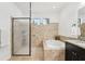 Beautiful bathroom featuring a walk-in shower and a soaking tub at 21834 Southern Charm Dr, Land O Lakes, FL 34637
