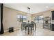 Cozy dining area featuring a modern light fixture and large windows providing plenty of natural light at 21834 Southern Charm Dr, Land O Lakes, FL 34637