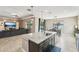 Open kitchen featuring granite counters, stainless appliances, and a view to the pool at 21834 Southern Charm Dr, Land O Lakes, FL 34637