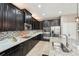 Modern kitchen features granite counters, tile backsplash, and stainless steel appliances at 21834 Southern Charm Dr, Land O Lakes, FL 34637