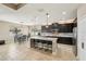 Spacious eat-in kitchen with granite island, stainless appliances and modern cabinetry at 21834 Southern Charm Dr, Land O Lakes, FL 34637