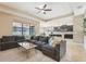 Spacious living room with an open concept design, seamlessly connecting to the kitchen and dining areas at 21834 Southern Charm Dr, Land O Lakes, FL 34637