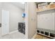 Mudroom with cubbies, bench, and laundry area featuring modern washer and dryer units at 21834 Southern Charm Dr, Land O Lakes, FL 34637