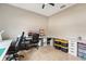 A spacious home office featuring an expansive desk, comfortable chairs, and ample storage space at 21834 Southern Charm Dr, Land O Lakes, FL 34637