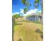 Expansive fenced backyard featuring mature trees and a lush lawn providing plenty of space for recreation at 2400 13Th S Ave, St Petersburg, FL 33712