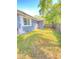 Private fenced yard showing a lawn and mature trees, perfect for outdoor living and entertainment at 2400 13Th S Ave, St Petersburg, FL 33712