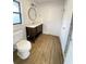 Bathroom features updated vanity with storage and modern fixtures at 2400 13Th S Ave, St Petersburg, FL 33712