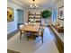 Bright dining room with modern light fixture, decor, and large neutral rug at 2400 13Th S Ave, St Petersburg, FL 33712