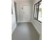 View of a clean entryway with a large window allowing natural light, creating a bright and inviting space at 2400 13Th S Ave, St Petersburg, FL 33712