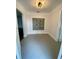 Bright entryway showcasing a unique glass block window and neutral paint, offering a welcoming feel at 2400 13Th S Ave, St Petersburg, FL 33712