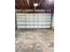 Spacious garage featuring a large white door and ample room for parking and storage at 2400 13Th S Ave, St Petersburg, FL 33712