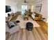 Cozy living room featuring a tan sectional sofa, ceiling fan, and hardwood floors at 2400 13Th S Ave, St Petersburg, FL 33712
