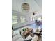 Open floor plan with dining and living areas, ceiling fans, and natural lighting at 2400 13Th S Ave, St Petersburg, FL 33712