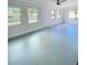 Spacious living room with natural light and unique flooring at 2400 13Th S Ave, St Petersburg, FL 33712