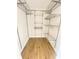 Walk-in closet featuring laminate flooring and wire shelving for maximum storage solutions at 2400 13Th S Ave, St Petersburg, FL 33712