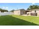 Expansive backyard featuring lush artificial turf, a spa, and a fenced perimeter at 2715 9Th N Ave, St Petersburg, FL 33713