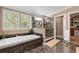 Luxurious bathroom featuring a soaking tub, tiled shower, and elegant fixtures, creating a spa-like retreat at 2715 9Th N Ave, St Petersburg, FL 33713
