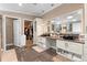 Elegant bathroom with double vanity, walk-in closet, and tile flooring, combining style and functionality at 2715 9Th N Ave, St Petersburg, FL 33713