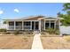 Charming home with a welcoming porch, landscaped front yard, and walkway leading to the front door at 2715 9Th N Ave, St Petersburg, FL 33713