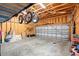 Garage with exposed rafters, mounted bikes and large garage door at 2715 9Th N Ave, St Petersburg, FL 33713