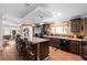 Spacious kitchen featuring a large island with granite countertops, dark wood cabinets, and stainless steel appliances at 2715 9Th N Ave, St Petersburg, FL 33713
