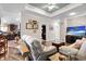 Comfortable living room featuring stone accents, a ceiling fan, and seamless flow into the adjacent kitchen at 2715 9Th N Ave, St Petersburg, FL 33713