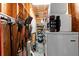 Organized storage area with shelving, tools, and appliances, maximizing space in the home's utility area at 2715 9Th N Ave, St Petersburg, FL 33713