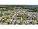 Real estate in the suburbs, showing houses amongst green trees and manicured lawns at 27330 Coral Springs Dr, Wesley Chapel, FL 33544