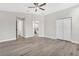 Large bedroom with walk-in closet and access to the bathroom at 27330 Coral Springs Dr, Wesley Chapel, FL 33544