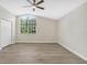Bedroom with natural light and a vaulted window at 27330 Coral Springs Dr, Wesley Chapel, FL 33544