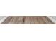 Close-up of neutral-colored wood flooring at 27330 Coral Springs Dr, Wesley Chapel, FL 33544