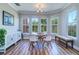 Inviting dining area with modern table, chairs, and bench seating in a well-lit space at 2755 Via Capri # 1223, Clearwater, FL 33764