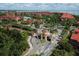 Community entrance with manicured grounds, palm trees, and an inviting gatehouse for residents at 2755 Via Capri # 1223, Clearwater, FL 33764