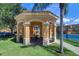 Charming gazebo with tiled roof, overlooking a playground and tennis court at 2755 Via Capri # 1223, Clearwater, FL 33764