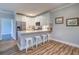 Well-lit kitchen featuring white cabinets, stainless steel appliances, and island seating at 2755 Via Capri # 1223, Clearwater, FL 33764